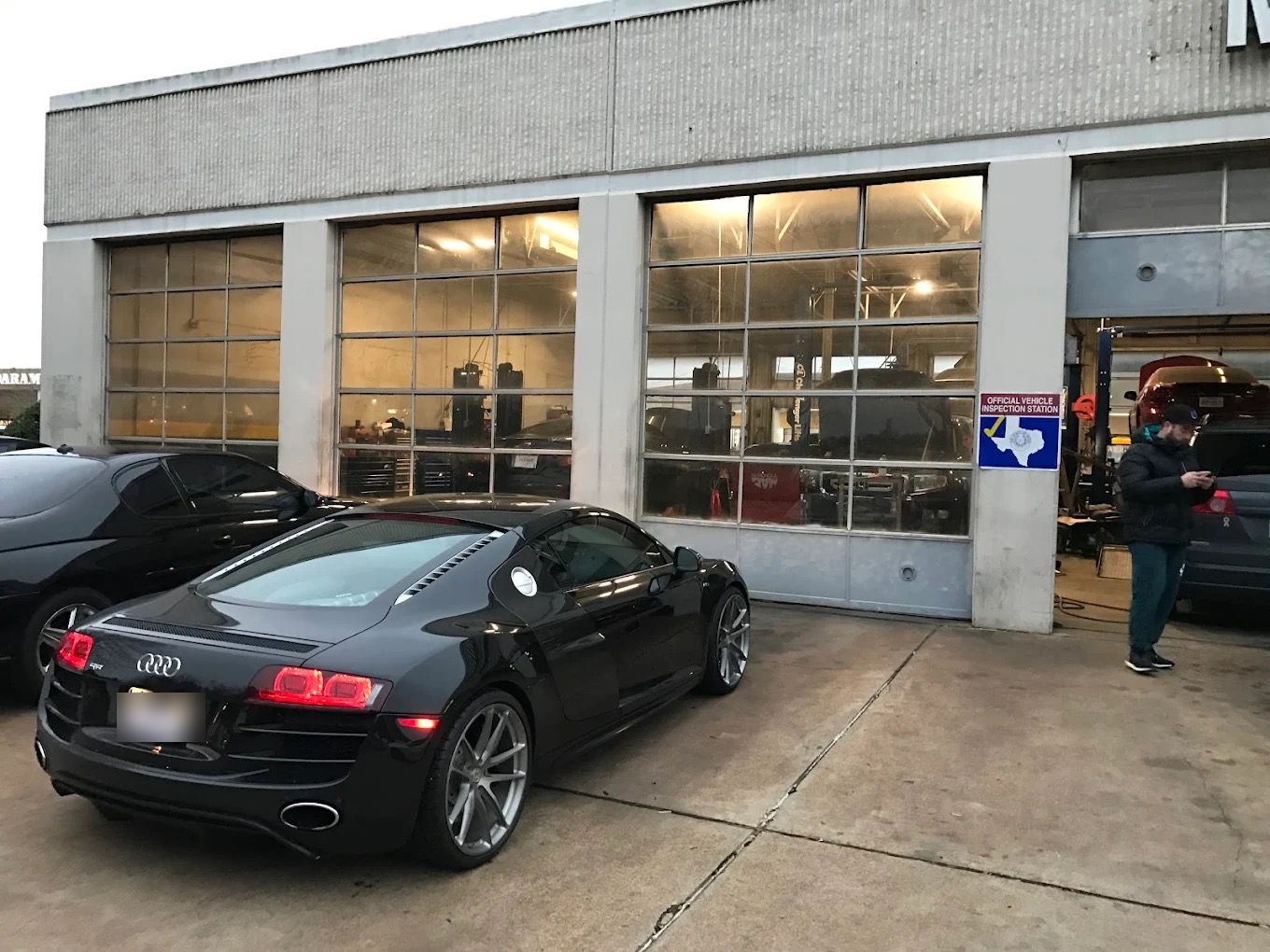 Black Audi R8 V10 parked in front of the bays