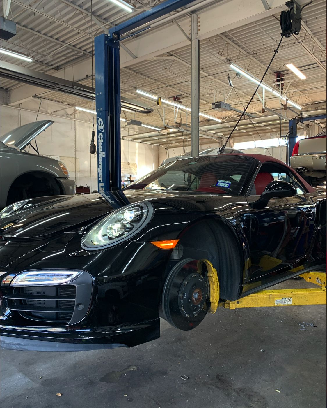 Porsche 911 Turbo Cabriolet on the lift with wheel removed